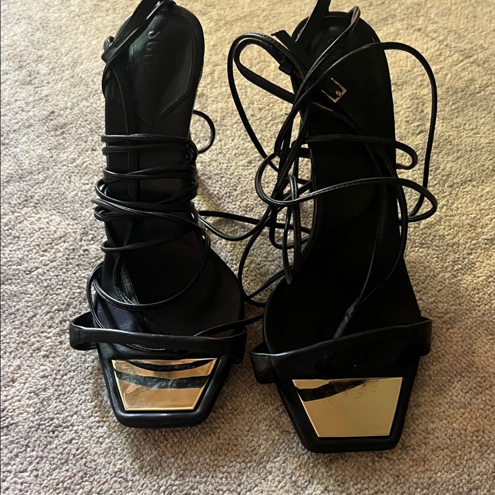 SCHUTZ Black and Gold Strappy Heels